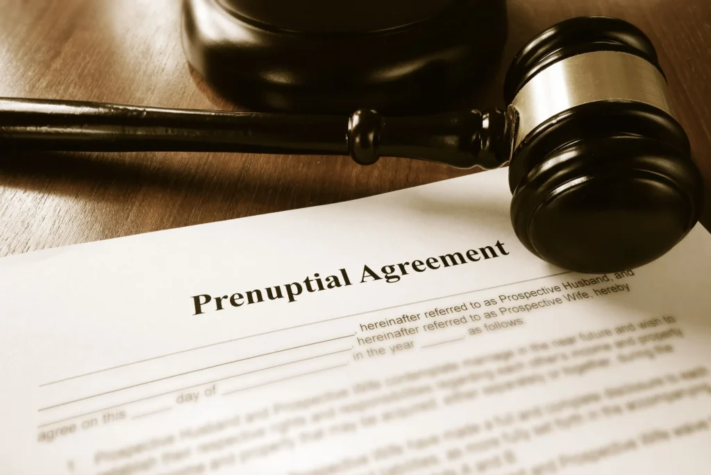 A prenuptial agreement with a gavel, on a desk.