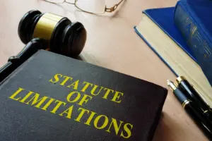 A book that reads statue of limitations and a gavel.