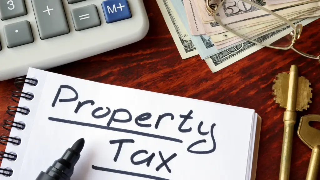 A notebook with "property tax" written in it.