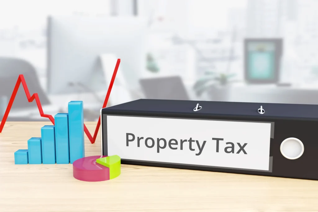 A binder with property tax written on the side.