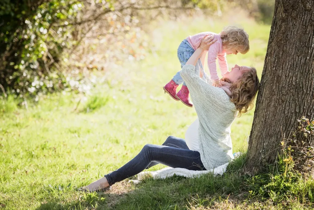 A woman and her child in the park.