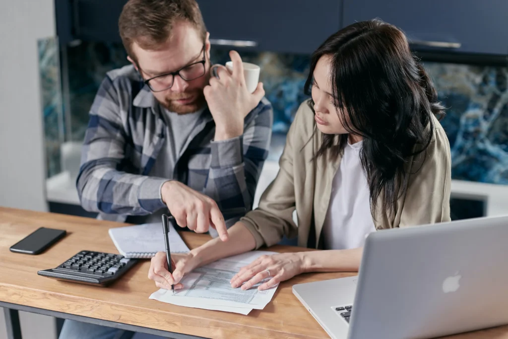 A couple looking over documents and financials.